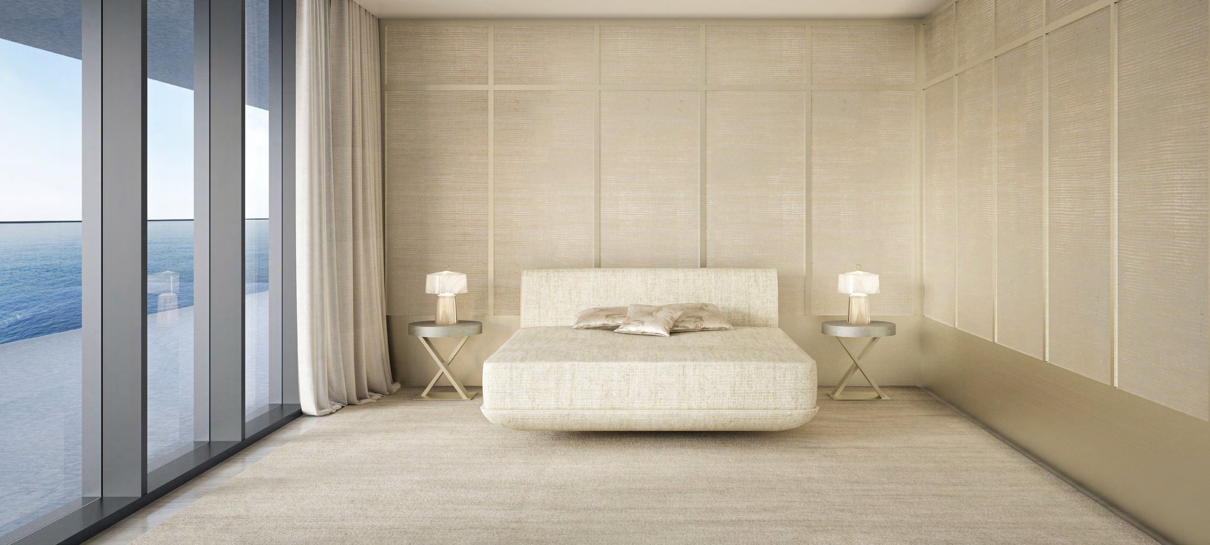 Cream bedroom with low bed and a glass wall onto the terrace and sea