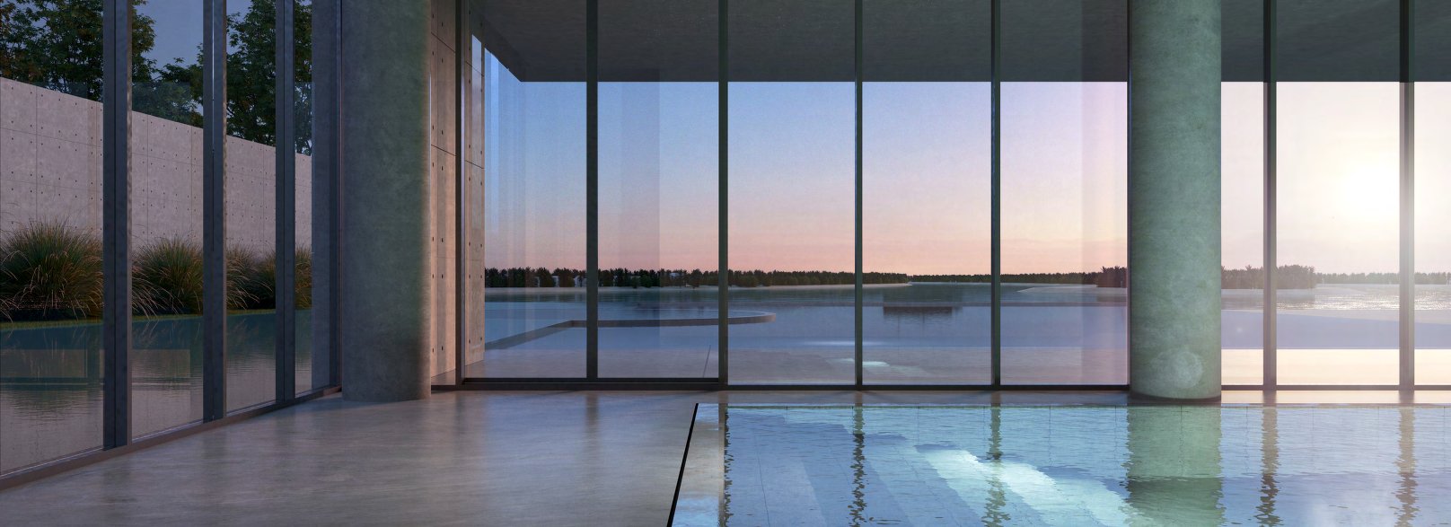 Indoor pool with concrete columns and floor-to-ceiling glass facing the water